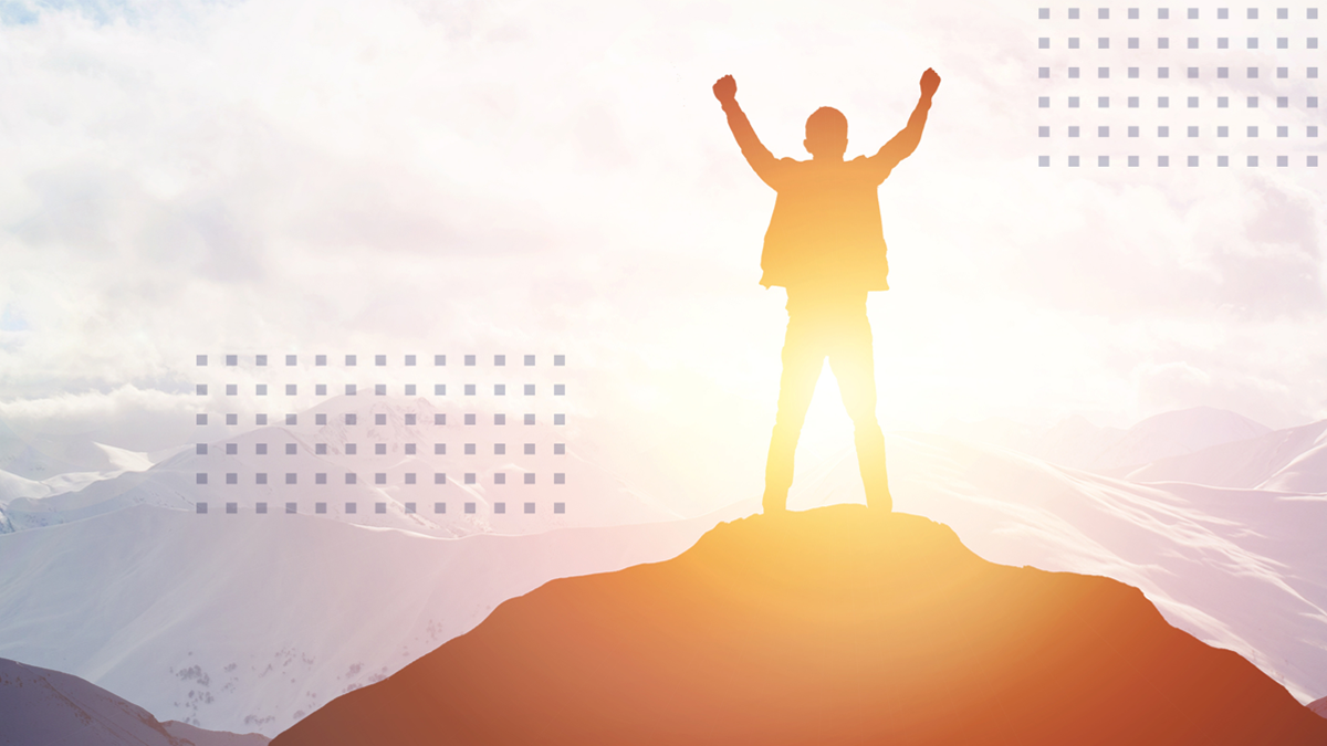 a man hand raising on top of mountain and sunset sky abstract background