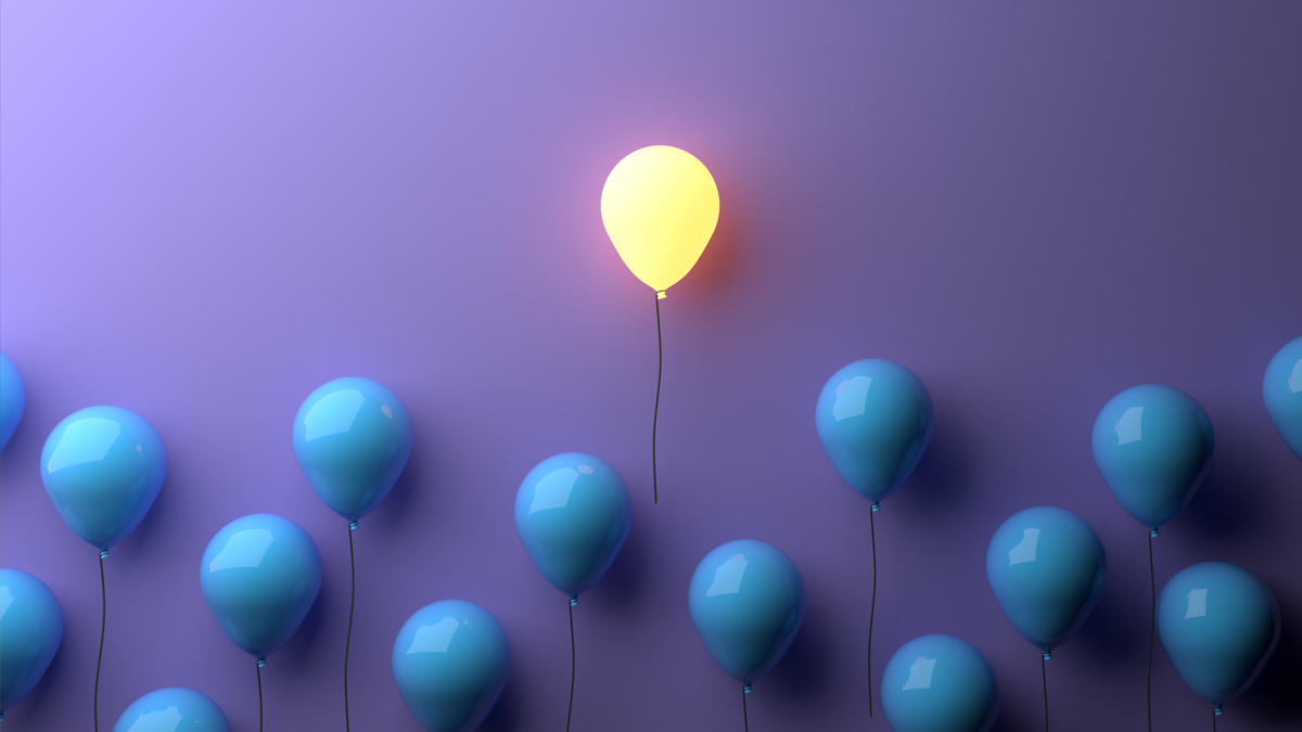 A single illuminated yellow balloon stands out from a row of blue balloons against a purple backdrop, standout concept