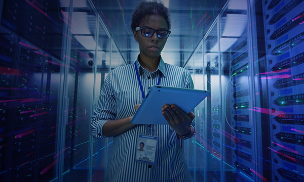 an IT engineer checks records inside the server room